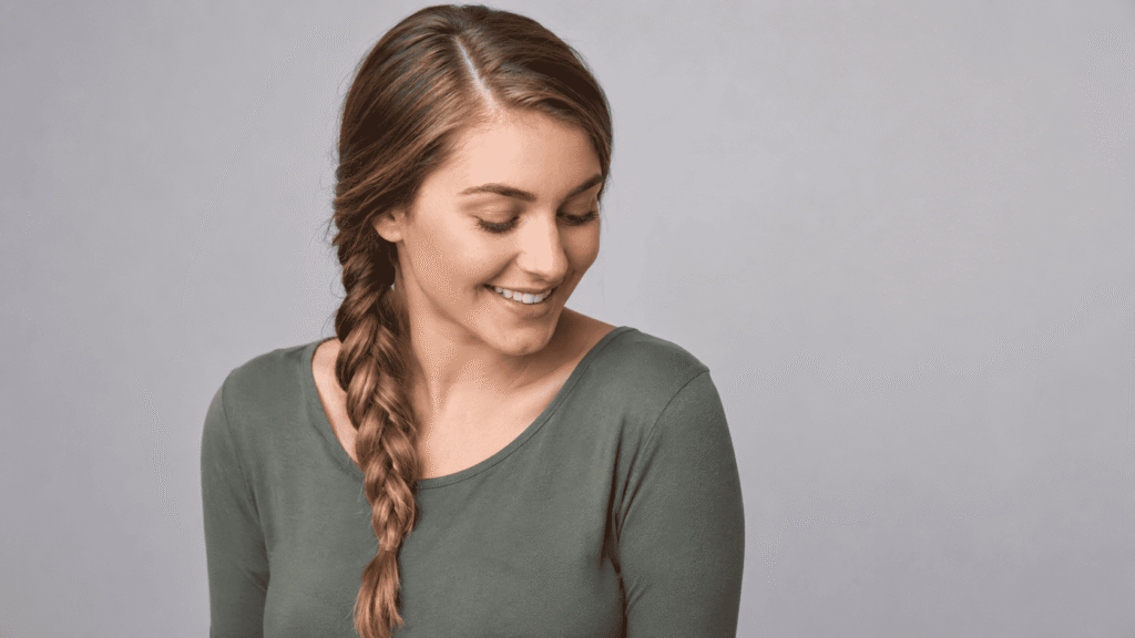 Deep side-parted braid hairstyle for frizzy hair in humid weather
