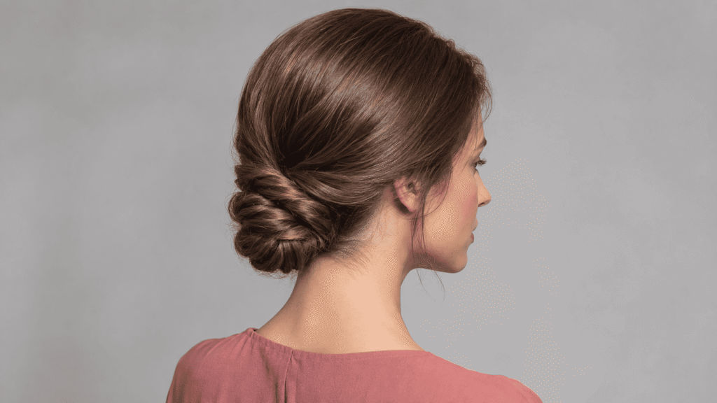 Low twisted chignon hairstyle that stays secure in humid weather