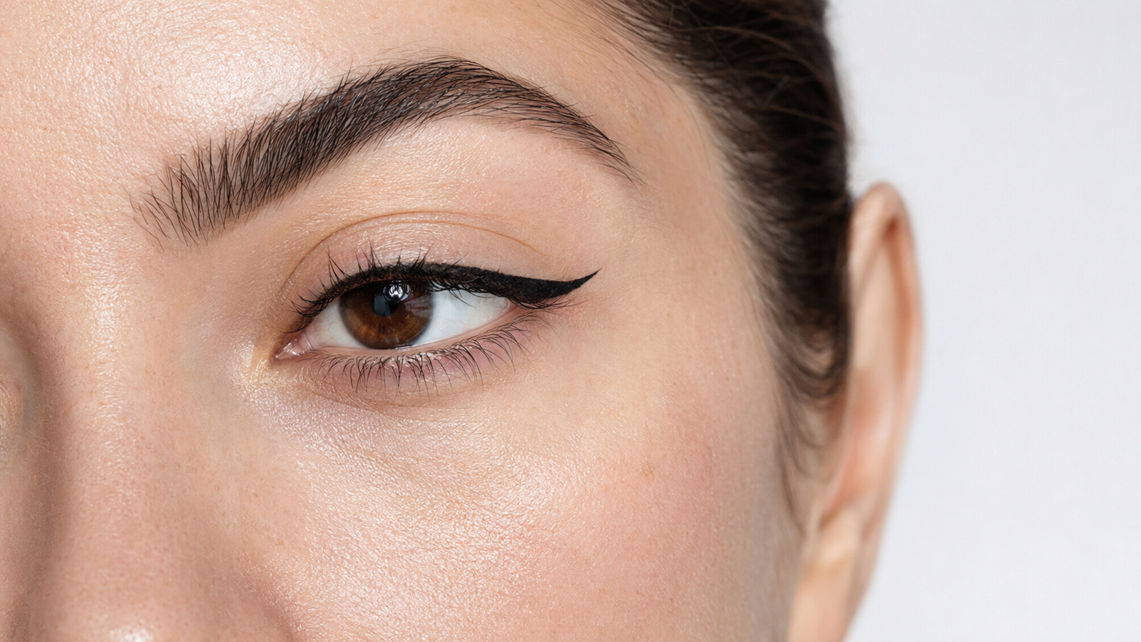 Close-up of long-lasting sharp winged eyeliner on oily lids
